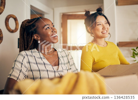 Happy, smile and lesbian couple moving in their new home with cardboard boxes together in living room. Happiness, love and interracial lgbtq women homeowners in the lounge of their modern apartment. Happy, smile and lesbian couple moving in their new home with cardboard boxes together in living room. Happiness, love and interracial lgbtq women homeowners in the lounge of their modern apartment. 136428535