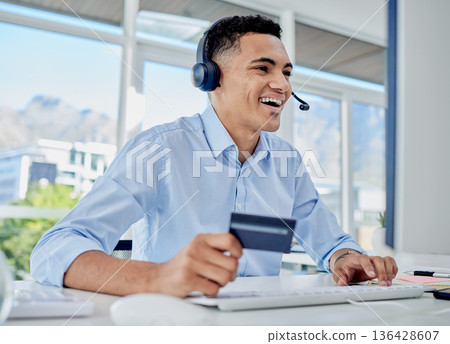 Credit card, online shopping and call center man in the office for sale, promotion or discount. Ecommerce, technology and male telemarketing agent paying bills, mortgage or debt online in workplace. 136428607