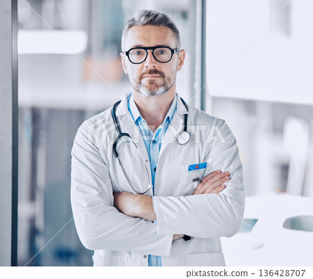 Mature doctor man, arms crossed and portrait for leadership in hospital, medical research or serious face for wellness. Professional medic, healthcare expert and clinic management job in Los Angeles Mature doctor man, arms crossed and portrait for leadership in hospital, medical research or serious face for wellness. Professional medic, healthcare expert and clinic management job in Los Angeles 136428707