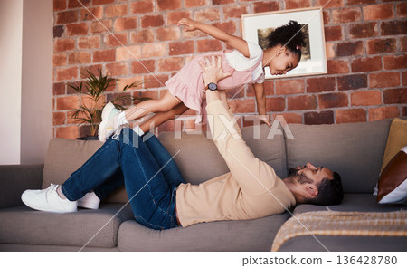Sofa, airplane and dad playing child or daughter enjoy game as bonding for care together in a home or house. Fly, love and father with kid in living room, happy and smile on weekend for happiness Sofa, airplane and dad playing child or daughter enjoy game as bonding for care together in a home or house. Fly, love and father with kid in living room, happy and smile on weekend for happiness 136428780