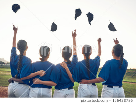 Baseball player, team and celebrate win outdoor with women on a pitch for sports competition. Behind professional athlete or softball group with success, winning or achievement and throw cap at game 136428786