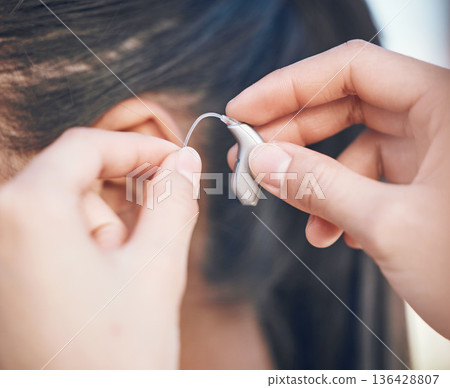 Closeup, hands and hearing aid support for person, listening help and medical gear. Healthcare, woman with a disability and audio health, clinic innovation and device for sound waves or communication 136428807