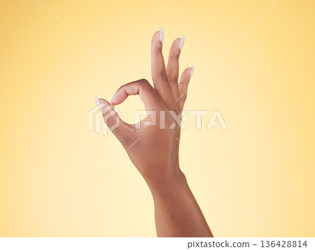 Great, ok and hand sign in studio with decision, agreement and success of good news. Yellow background, yes vote and accept approval of a person showing agree, opinion and emoji icon and signal Great, ok and hand sign in studio with decision, agreement and success of good news. Yellow background, yes vote and accept approval of a person showing agree, opinion and emoji icon and signal 136428814