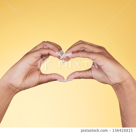 Woman, heart hands and symbol for love, support or care in trust against a studio background. Closeup of female person with loving emoji, gesture or sign in romance, valentines day or shape on mockup Woman, heart hands and symbol for love, support or care in trust against a studio background. Closeup of female person with loving emoji, gesture or sign in romance, valentines day or shape on mockup 136428815
