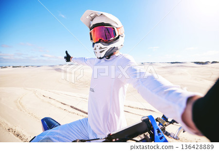 Selfie, motorcycle and man in desert adventure, nature and sports outdoor on mockup space. Bike, helmet and person take picture at sand for social media, transportation and off road travel in Morocco 136428889