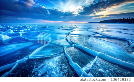 A macro shot of blue ice texture reveals transparent frozen crystals and a clear abstract pattern of frost inside a cold glass cube of water 136429383