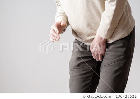Middle-aged man with frequent urination, urinary urge, urinary incontinence, body parts 136429522