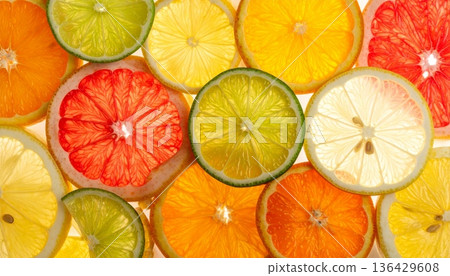 A seamless vector pattern of fresh citrus fruit slices featuring juicy lemon, orange, lime, and grapefruit for a healthy ripe food background illustration A seamless vector pattern of fresh citrus fruit slices featuring juicy lemon, orange, lime, and grapefruit for a healthy ripe food background illustration 136429608