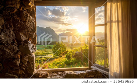 An empty room inside an old abandoned house featuring a stone wall, a dusty floor, and sunlight streaming through an ancient window near a dark fireplace in this urban architecture 136429686