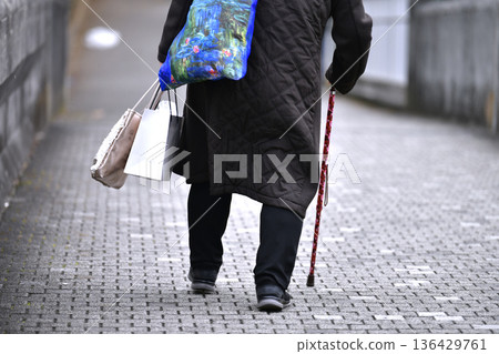 Yokohama cityscape in Japan: Downhill... After the stairs comes a steep downhill... Aging society: Elderly woman with a cane = Yokohama city Yokohama cityscape in Japan: Downhill... After the stairs comes a steep downhill... Aging society: Elderly woman with a cane = Yokohama city 136429761
