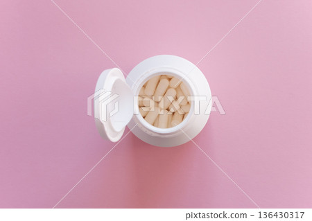Much medical pills and drugs in white package on the pink background. Healthcare concept. Space for text. 136430317