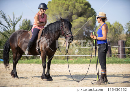riding girl and horse riding girl and horse 136430362