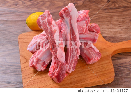 Note: This is uncooked raw meat and meat products. Pork spare ribs, pork belly on the bone, and BBQ meat. Note: This is uncooked raw meat and meat products. Pork spare ribs, pork belly on the bone, and BBQ meat. 136431177