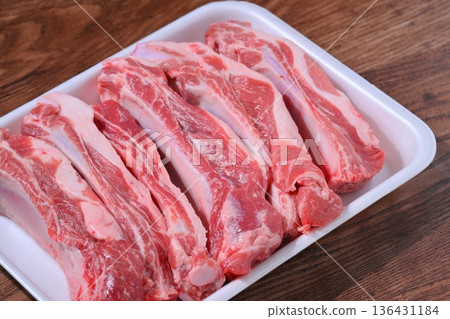 Note: This is uncooked raw meat and meat products. Pork spare ribs, pork belly on the bone, and BBQ meat. 136431184