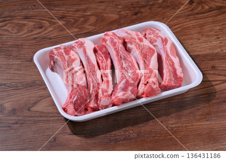 Note: This is uncooked raw meat and meat products. Pork spare ribs, pork belly on the bone, and BBQ meat. Note: This is uncooked raw meat and meat products. Pork spare ribs, pork belly on the bone, and BBQ meat. 136431186