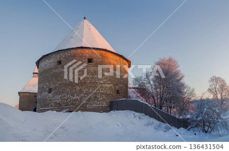 A large tower with a snow covered roof. A large tower with a snow covered roof. 136431504