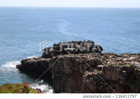 High angle view of rocky cliffs and Atlantic ocean in Cascais, Portugal. 136431797
