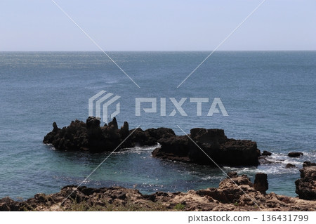 Sharp volcanic rock formations in the Atlantic Ocean, Cascais coastline, Portugal. Sharp volcanic rock formations in the Atlantic Ocean, Cascais coastline, Portugal. 136431799