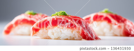 Fresh tuna nigiri sushi serving with green onion. Three pieces of fresh tuna nigiri sushi on a minimal white background 136431930