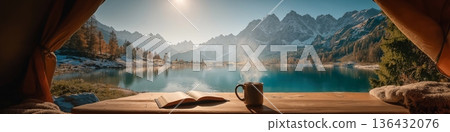 Camping view from tent enjoying lake and mountains. View from inside a tent, enjoying a steaming coffee and book by a clear lake and snowy mountains Camping view from tent enjoying lake and mountains. View from inside a tent, enjoying a steaming coffee and book by a clear lake and snowy mountains 136432076