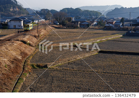 Heisei Chikuho Railway 400 Series "Nanohana" train heading to the town in early spring Heisei Chikuho Railway 400 Series "Nanohana" train heading to the town in early spring 136432479