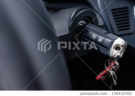 Ignition key inserted into steering column of commercial vehicle Ignition key inserted into steering column of commercial vehicle 136432502