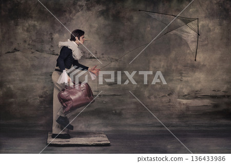 Man with long nose flying kite while holding suitcase in surreal vintage scene. Man with long nose flying kite while holding suitcase in surreal vintage scene. 136433986
