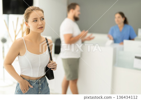 Young woman standing in dental clinic Young woman standing in dental clinic 136434112