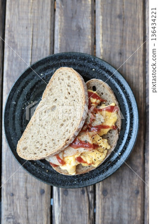 Berliner Landbrot sandwich: Scrambled egg sandwich on German rye bread 136434221