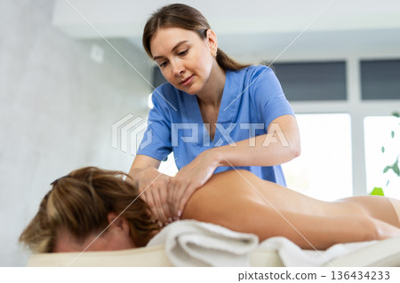 Woman relax during massage spine 136434233