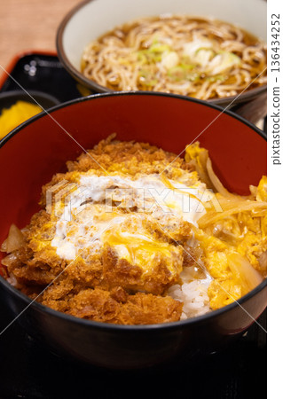 Delicious pork cutlet bowl and soba noodle set Delicious pork cutlet bowl and soba noodle set 136434252