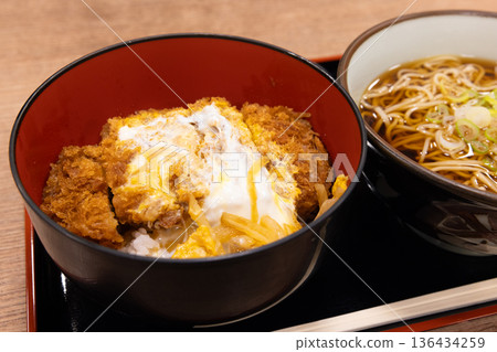 Delicious pork cutlet bowl and soba noodle set Delicious pork cutlet bowl and soba noodle set 136434259