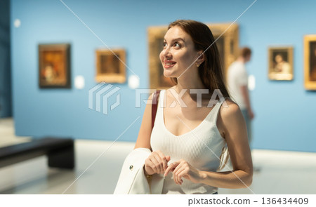 Girl view pictures and icons in museum hall Girl view pictures and icons in museum hall 136434409