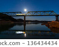 A local train running on a railway bridge under the moonlight 136434434