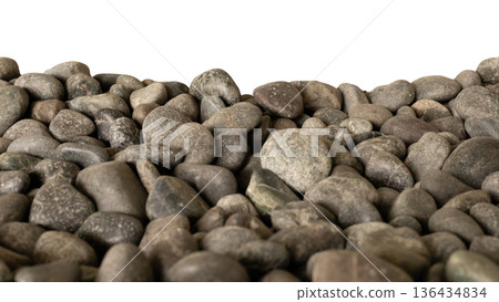 Many smooth river stones are scattered on white background. The stones vary in size and color, showing their different shapes and textures 136434834