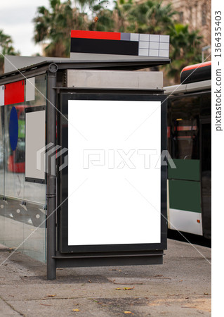 Blank billboard and ad screen at a bus stop providing clear space for digital marketing, outdoor advertising, and promotional mock-ups in a public urban setting Blank billboard and ad screen at a bus stop providing clear space for digital marketing, outdoor advertising, and promotional mock-ups in a public urban setting 136435403