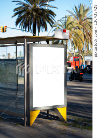Blank vertical billboard mockup at a city bus stop, offering ample space for advertising, marketing campaigns, or public information in an urban environment Blank vertical billboard mockup at a city bus stop, offering ample space for advertising, marketing campaigns, or public information in an urban environment 136435429