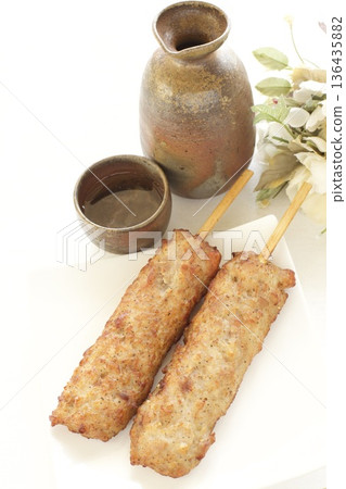 Chicken meatballs with pork belly and sake 136435882