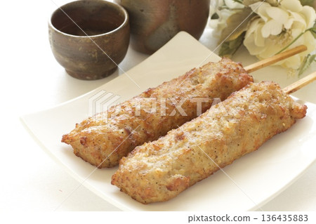 Chicken meatballs with pork belly and sake 136435883