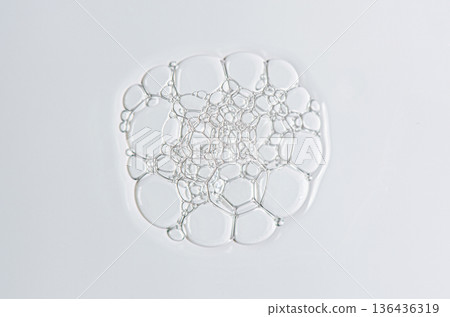 Sample of the foam of shower gel or soap suds or shaving foam. Cosmetic skin care product. Macrophotography. 136436319