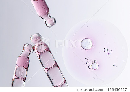 Skin serum in a pipette. A cosmetic product for body care. White background. 136436327