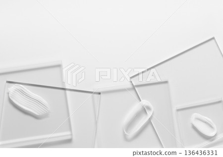 White cosmetic skin care product on glass. White background. Copy space 136436331