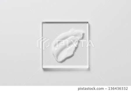 White cosmetic skin care product on glass. White background. 136436332