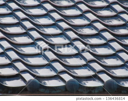 Old tiled roof wet with rain Old tiled roof wet with rain 136436814