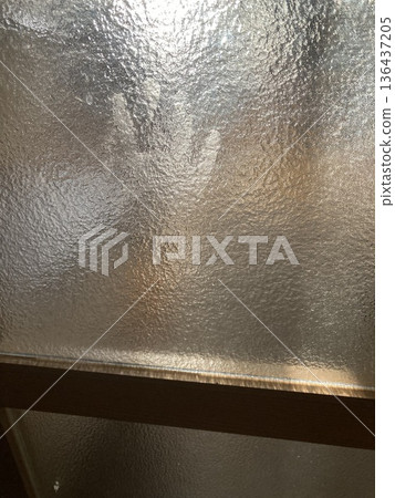 Child's handprints left on frosted glass Child's handprints left on frosted glass 136437205