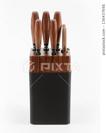 Set of kitchen knives on a stand. White background. Set of kitchen knives on a stand. White background. 136437698