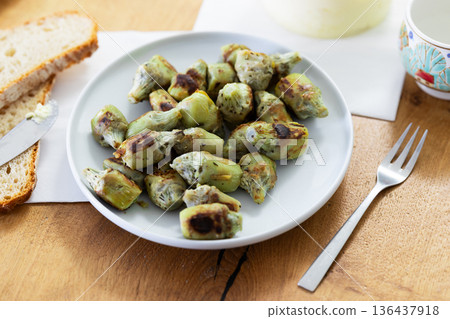 fried baby artichokes on plate fried baby artichokes on plate 136437918