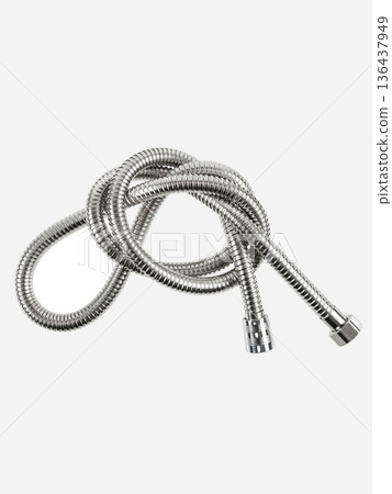 Shower hose is insulated on a white background. The hose is flexible, metal, chrome-plated. 136437949