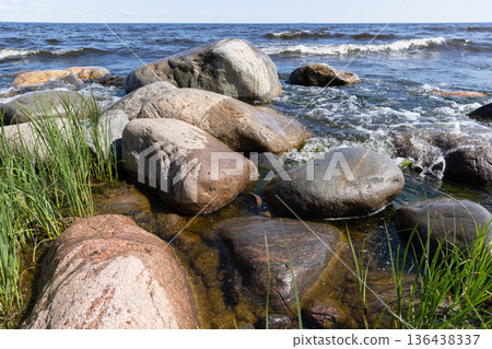 Shoreline landscape photo of Ladoga lake with wet stones 136438337