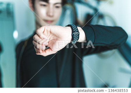 Man checks his watch 136438553